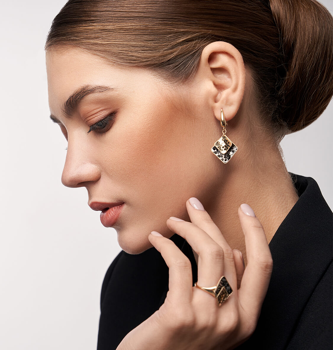Model wearing statement earrings